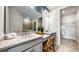 Modern bathroom with double sinks, sleek countertops, and a walk-in closet, offering both style and functionality at 29477 Velletri Ln, Wesley Chapel, FL 33543