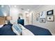 Relaxing bedroom featuring neutral walls, plush carpet, and tasteful decor at 29477 Velletri Ln, Wesley Chapel, FL 33543