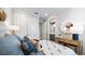 Bedroom with stylish decor, closet, and a view into the en suite bathroom at 29477 Velletri Ln, Wesley Chapel, FL 33543