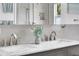 A close up of a double sink vanity, marble countertop, and brushed nickel faucets at 326 16Th Ne Ave, St Petersburg, FL 33704