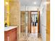 Bathroom showcasing stylish walk-in shower, vanity with sink, and decorative tiling details at 326 16Th Ne Ave, St Petersburg, FL 33704