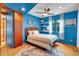 Cozy bedroom with blue walls, a queen size bed, and a ceiling fan at 326 16Th Ne Ave, St Petersburg, FL 33704