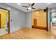 Bedroom with wood floors, custom wall cabinets, and ensuite bathroom for added convenience at 326 16Th Ne Ave, St Petersburg, FL 33704