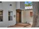 Unique front door design with wood accents, complemented by stylish landscaping and modern architectural details at 326 16Th Ne Ave, St Petersburg, FL 33704