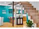 Open concept interior with modern staircase, breakfast bar and stylish accents at 326 16Th Ne Ave, St Petersburg, FL 33704