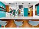 Modern kitchen with marble countertops, stainless steel appliances, pendant lights, and blue accent walls at 326 16Th Ne Ave, St Petersburg, FL 33704