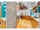 Bright, spacious kitchen features wood cabinets, granite counters, stone accent wall, stainless steel appliances and a beverage cooler at 326 16Th Ne Ave, St Petersburg, FL 33704