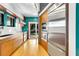 Modern kitchen featuring stainless steel appliances, wood cabinets, and access to the backyard at 326 16Th Ne Ave, St Petersburg, FL 33704