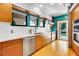 Bright, modern kitchen with stainless steel appliances, white subway tiles, and an open doorway to the backyard at 326 16Th Ne Ave, St Petersburg, FL 33704