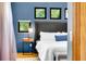 Close up of the king bed, three windows, and a modern lamp on the nightstand at 326 16Th Ne Ave, St Petersburg, FL 33704