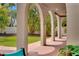 Covered patio featuring elegant archways, lush greenery, and serene views of the backyard at 326 16Th Ne Ave, St Petersburg, FL 33704
