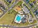 Aerial view of community amenities, including a playground, pool, and parking at 4201 Globe Thistle Dr, Tampa, FL 33619