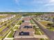 Neighborhood street featuring single-Gathering homes with solar panels and well-kept lawns at 4201 Globe Thistle Dr, Tampa, FL 33619