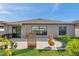 Cozy backyard patio featuring sliding glass doors and simple, low-maintenance landscaping at 4201 Globe Thistle Dr, Tampa, FL 33619