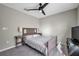 Bedroom with ceiling fan, carpeted floor, and closet at 4201 Globe Thistle Dr, Tampa, FL 33619