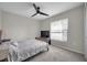 Cozy bedroom featuring a ceiling fan, closet, and a large window at 4201 Globe Thistle Dr, Tampa, FL 33619