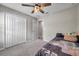 Bedroom featuring a large closet, ceiling fan, and gray carpet at 4201 Globe Thistle Dr, Tampa, FL 33619