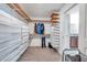 Large walk-in closet with ample storage shelves and hanging space; well-organized and bright at 4201 Globe Thistle Dr, Tampa, FL 33619