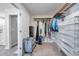 Walk-in closet featuring an organization system with shelving, drawers, rods, and natural lighting at 4201 Globe Thistle Dr, Tampa, FL 33619