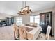 Inviting dining area with stylish light fixture, adjacent to the living space at 4201 Globe Thistle Dr, Tampa, FL 33619
