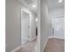 Hallway view showcasing interior doors and neutral wall colors at 4201 Globe Thistle Dr, Tampa, FL 33619