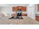 Modern kitchen featuring granite countertops, ample cabinet space, and a convenient kitchen island at 4201 Globe Thistle Dr, Tampa, FL 33619