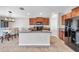 Well-equipped kitchen with granite countertops, stainless steel appliances, and an adjacent dining area at 4201 Globe Thistle Dr, Tampa, FL 33619