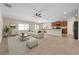Open-concept living space featuring comfortable seating, tile floors, and a seamless flow to the dining area at 4201 Globe Thistle Dr, Tampa, FL 33619