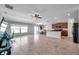Bright, open living space flowing into a modern kitchen and dining area with tile flooring at 4201 Globe Thistle Dr, Tampa, FL 33619
