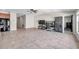 Open-concept living room features tile floors, ceiling fan, and provides access to other rooms within the home at 4201 Globe Thistle Dr, Tampa, FL 33619