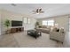 Inviting living room with a cozy atmosphere, featuring neutral tones, and a large window at 4201 Globe Thistle Dr, Tampa, FL 33619