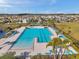 A stunning aerial view of a large, resort-style pool with plenty of lounge chairs in a beautiful community at 4201 Globe Thistle Dr, Tampa, FL 33619