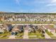 Street view of homes in a residential neighborhood with solar panels on the roofs and well-kept lawns at 4201 Globe Thistle Dr, Tampa, FL 33619