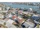 Real estate aerial view of waterfront homes along canal with partial water and city views at 440 S Bayshore Dr, Madeira Beach, FL 33708