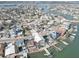 An aerial view of waterfront homes with private docks on a sunny day at 440 S Bayshore Dr, Madeira Beach, FL 33708
