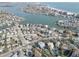 Beautiful aerial view of waterfront real estate with canal access and beach views at 440 S Bayshore Dr, Madeira Beach, FL 33708