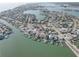 Aerial view showcasing waterfront homes with private docks in a picturesque coastal community at 440 S Bayshore Dr, Madeira Beach, FL 33708