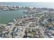 An aerial shot of waterfront homes near a beach and waterway, showcasing the coastal living environment at 440 S Bayshore Dr, Madeira Beach, FL 33708