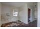 Modest bedroom with a window and doorway to a bathroom at 440 S Bayshore Dr, Madeira Beach, FL 33708