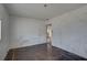 Bare bedroom displaying damaged walls, window and visible flooring at 440 S Bayshore Dr, Madeira Beach, FL 33708