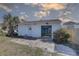 Exterior of a detached structure with sliding glass door at 440 S Bayshore Dr, Madeira Beach, FL 33708
