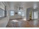 Spacious living room with abundant natural light from windows and hardwood floors at 440 S Bayshore Dr, Madeira Beach, FL 33708