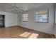 Bright living room with hardwood floors, ceiling fan, and windows at 440 S Bayshore Dr, Madeira Beach, FL 33708