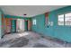 Unfinished room with blue walls and natural light from windows at 440 S Bayshore Dr, Madeira Beach, FL 33708