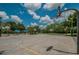 Full basketball court with hoops and benches available for residents under a clear blue sky at 4693 Aylesford Dr, Palm Harbor, FL 34685