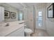 Bathroom featuring a glass shower, a toilet, and a vanity at 4693 Aylesford Dr, Palm Harbor, FL 34685