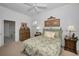 Relaxing bedroom with natural light, en-suite bathroom, and comfortable furnishings at 4693 Aylesford Dr, Palm Harbor, FL 34685