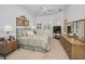 Calm bedroom featuring neutral colors, shuttered windows and pool view at 4693 Aylesford Dr, Palm Harbor, FL 34685