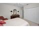 Bedroom featuring a dresser with a mirror, a ceiling fan, and a closet at 4693 Aylesford Dr, Palm Harbor, FL 34685