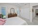 Bedroom featuring a dresser with a mirror, a ceiling fan, and a closet at 4693 Aylesford Dr, Palm Harbor, FL 34685